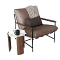 Brown Leather Single Sofa with Light Blanket Dark Pillow and Wooden Side Table