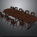 Oval Wooden Dining Table With Eight Wooden Chairs And Green Candlesticks