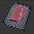 Fresh Raw Ribeye Steak on Black Baking Tray with Rosemary Garnish