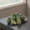 Fresh Ripe Avocados Halved With Pit On Plate Dark Table By Window