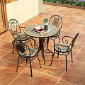 Wrought Iron Outdoor Table with Four Chairs on Patio Tile Floor and City View