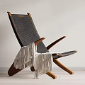Modern Lounge Chair With Woven Design Wooden Frame And Cozy Blanket In Living Space