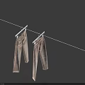 Two light colored jeans hanging on clothesline against deep blue sky 3d model