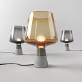 Modern Table Lamp With Amber Glass Shade And Concrete Base For Interior Decor