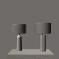 Two Modern Table Lamps With White Speckled Bases And Beige Lampshades On Light Table