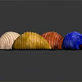 Colorful Textured Caterpillars in Red Brown Blue White and Yellow on Dark Background