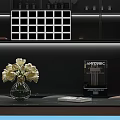 White Flowers in Transparent Glass Vase with ANYCUBIC Device Book and White Grid Decoration