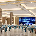 Spacious Banquet Hall Featuring White Tablecloths Blue Ribbons And Flower Centerpieces