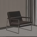 Brown Leather Accent Chair with Metal Frame Against Beige Wall and Dark Curtains