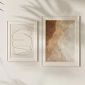 Two Framed Artworks Abstract Line Drawing Gold Beige Pattern On Light Wall With Plant Shadows