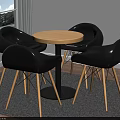 Modern Round Dining Table With Black Chairs And Wooden Legs On Gray Rug