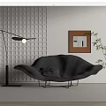 Black Leaf Shaped Chaise Lounge With Floor Lamp Grid Patterned Wall Painting And Green Plant