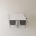 White Office Desk With Two Chairs Featuring Black Seats in Simple Modern Interior Space