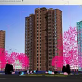 Modern High Rise Residential Building Red Brick Exterior Surrounded By Green Trees Under Blue Sky