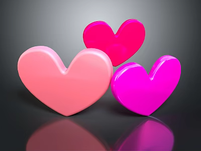 Three Shiny Heart Shapes In Light Pink Red And Bright Pink With Reflection 3d model
