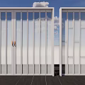 Modern Folding Doors With White Frame And Glass Panels For Indoor Outdoor Connection