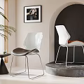 Stylish Accent Chair Featuring Transparent Back Black Cushion Metal Legs And Side Table Near Window