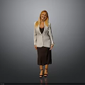 Woman In White Blazer Black Top Brown Skirt And High Heels Standing On Gray Background