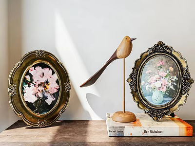 Decorative Ornament Set Featuring Golden Frame Floral Paintings And Wooden Bird Figurine On Books 3d model