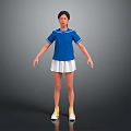 Woman in Blue Top and White Pleated Skirt with Yellow Sneakers Standing
