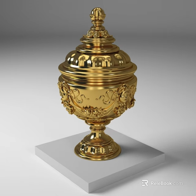 Elegant Golden Decorative Ornament Set With Intricate Patterns On White Pedestal 3d model 