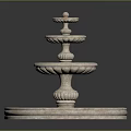 Three Tier Decorative Stone Fountain With Circular Base And Ornate Design