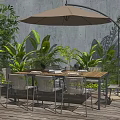 Outdoor Wooden Dining Table And Chairs With Patio Umbrella And Green Plants