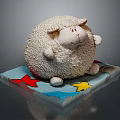 Fluffy White Sheep Doll Sitting On Blue Base With Red And Yellow Stars