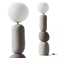 Minimalist Modern Floor Lamps With White Spherical Shades And Textured Bases