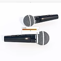 Two Black Handheld Microphones With Silver Mesh Grille And Ergonomic Grip Design