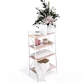 Multilayer Shelf Unit With Green Plant White Bowl Woven Basket And Folded Towel