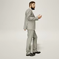 A Man In Gray Suit With Tie Standing Against White Background In Relaxed Pose