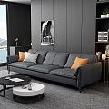 Gray Three Seater Sofa With Orange White Cushions In Modern Living Room With Wall Art