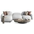White Sectional Sofa with Brown and Beige Cushions and Side Coffee Tables with Magazines