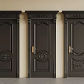 Classic Black Security Doors with Intricate Carved Designs and Golden Handles