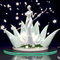 Photo Spot Featuring Elegant White Statue On Lotus Base With Snowflake Decorations And Green Lights