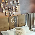 Double Bed with Headboard Decor Nightstand Lamp and Sofa in Bright Bedroom with Window