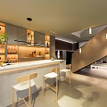 Modern Bar Area With Counter Stools Wine Racks And Decorative Plants