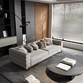 Modern Living Room With Gray Sofa Throw Pillows Round Coffee Table Books And Window Blinds