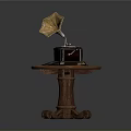 Vintage Gramophone On Wooden Table With Carved Legs And Small Items