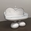 Apple Shaped Public Chair With Red Exterior Yellow Interior And Black Legs