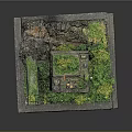 Miniature Tower Model With Moss Covered Structure And Surrounding Green Plants
