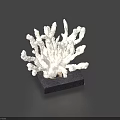 White Coral Shaped Carved Sculpture With Intricate Branching Design On Dark Base