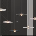 Modern Circular Pendant Lights With Metallic Frames Illuminated In Contemporary Interior 3d model