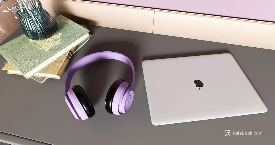 Modern Apple Laptop With Purple Headphones And Stack Of Books On Desk 3d model