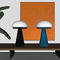 Stylish Table Lamps With White Shades Black Blue Bases On Wooden Table Orange Painting Green Leaves