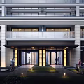 Modern Main Entrance Gate Featuring Glass Doors Outdoor Lighting and Landscaped Lawn with People Walking