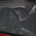 Red Muscle Car With Sleek Exterior Design And Black Alloy Wheels