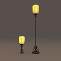 Two Different Sizes Floor Lamps With Yellow Lampshades And Dark Decorative Bases