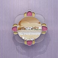 Round Mirror with Pink and Gold Decorations Reflecting Bedroom with Bed and Nightstand